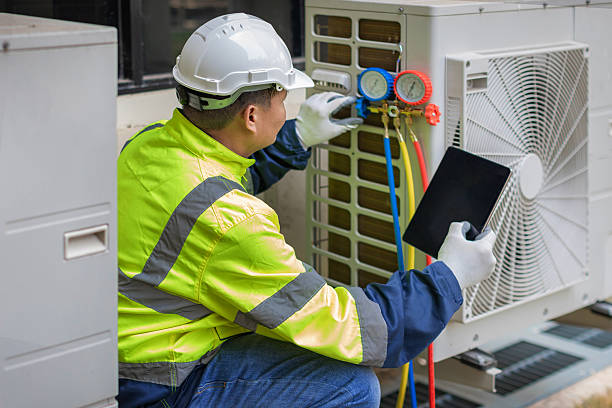 Professional Hvac technician working in Munford, AL